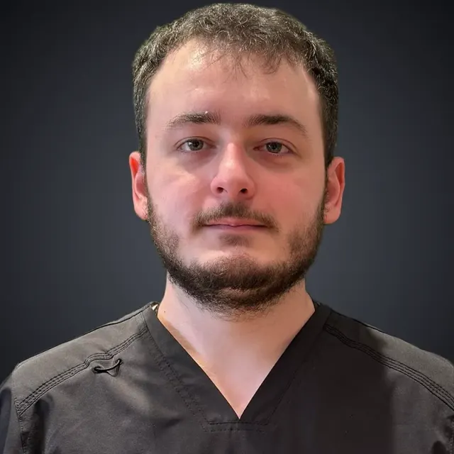 Jacob Bergtold, Therapy Technician at Bergtold Chiropractic in Naples, Florida, in the therapy room
