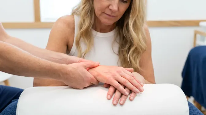 Patient receiving Emvital deep-heat laser therapy for pain at Bergtold Chiropractic in Naples, FL