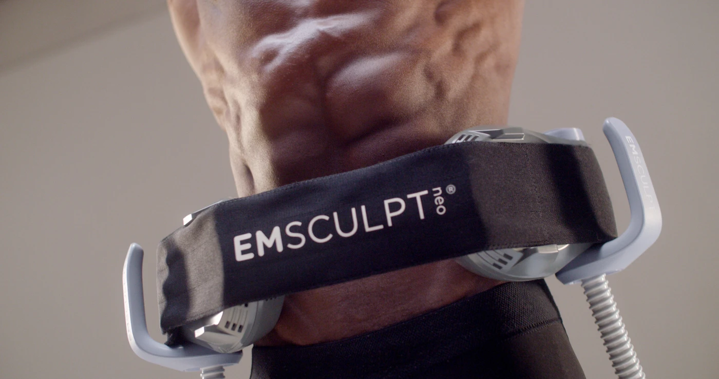 Emsculpt Neo in Naples, FL with the HIFEM applicator positioned over a patient abdomen at Bergtold Chiropractic